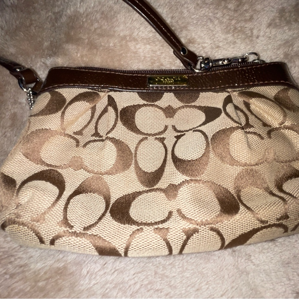 brown Coach wristlet clutch